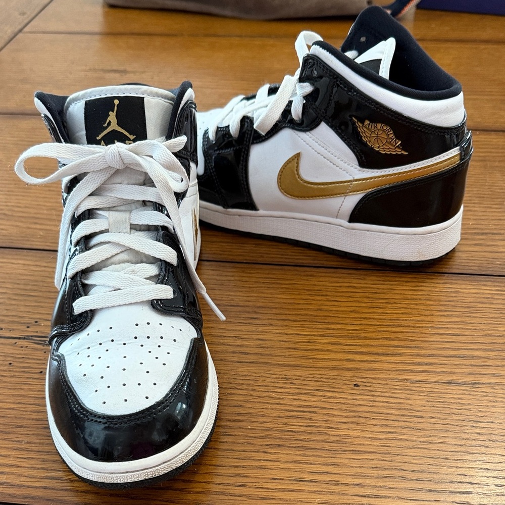 Nike Kids Air Jordan Black and White Sneakers with Gold Accents